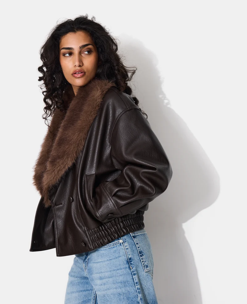 Blouson en simili grand col fausse fourrure