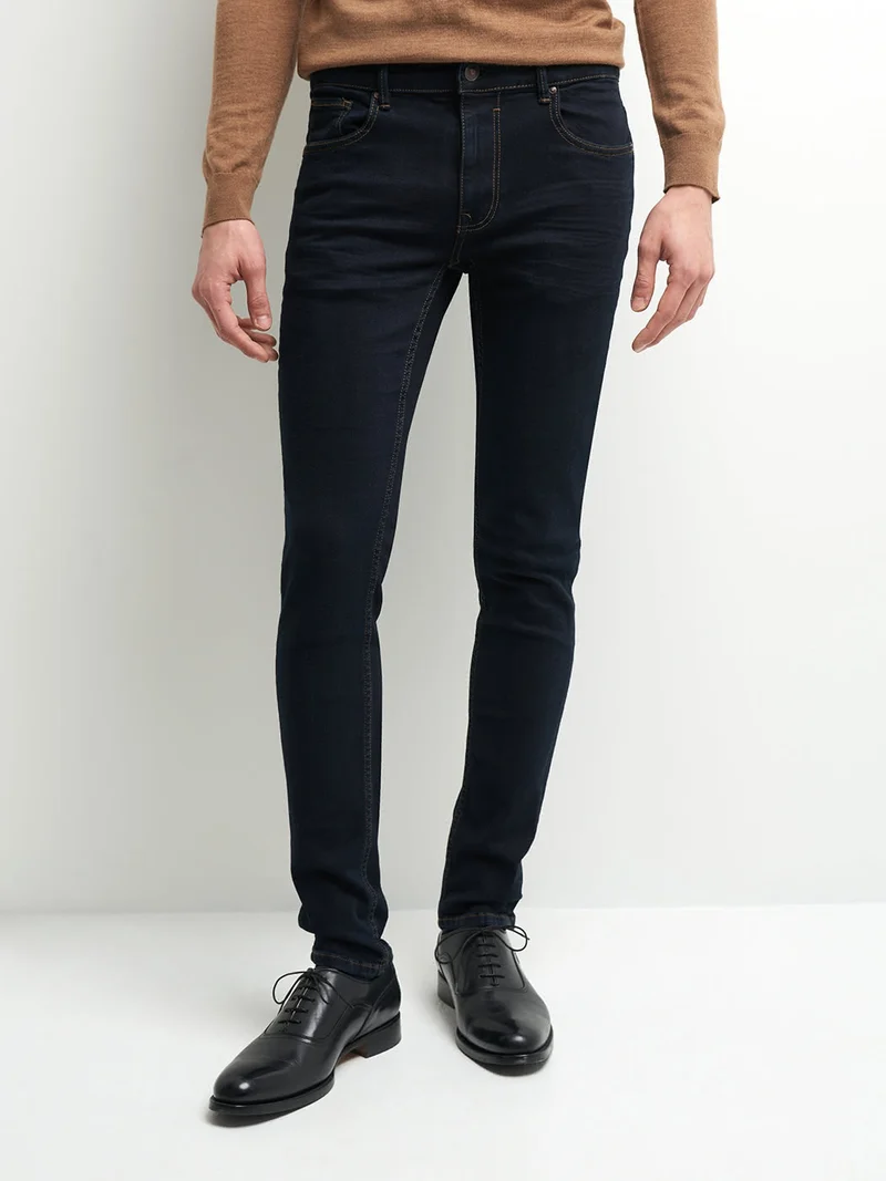 Jean xslim en coton élasthane brut