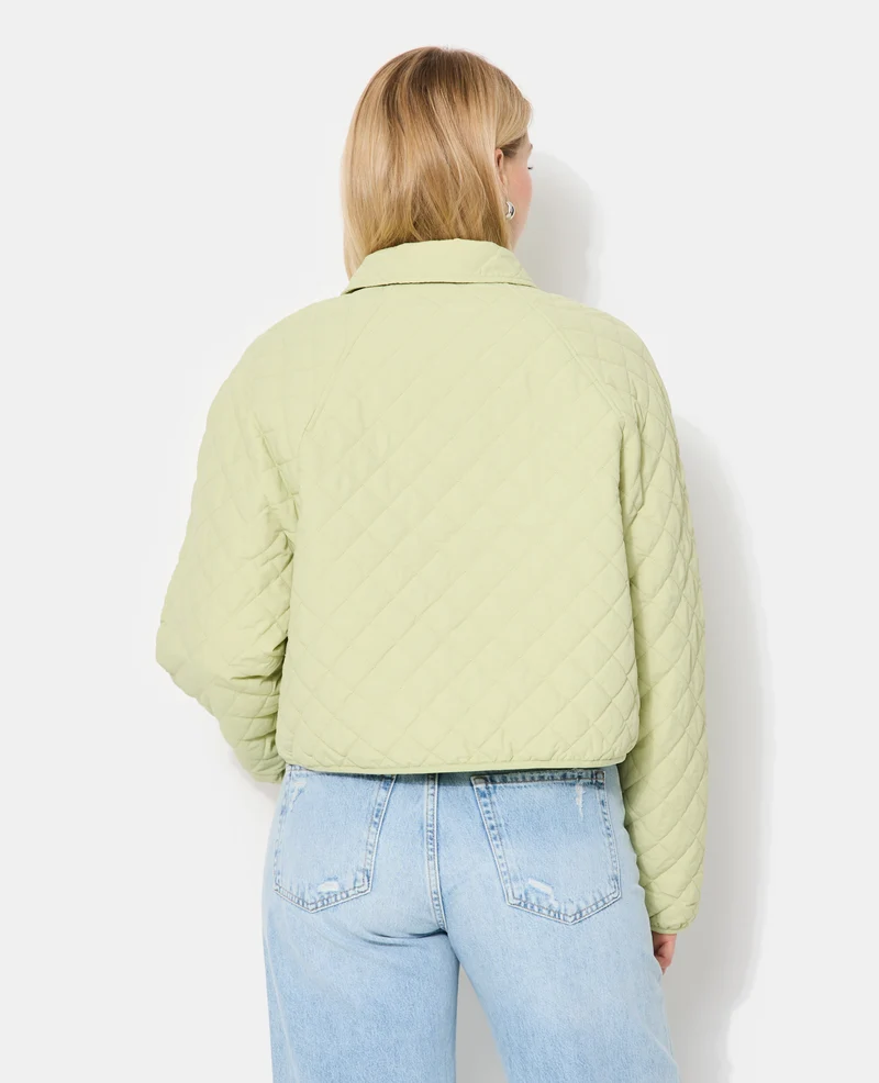 Blouson matelassé avec col et poches