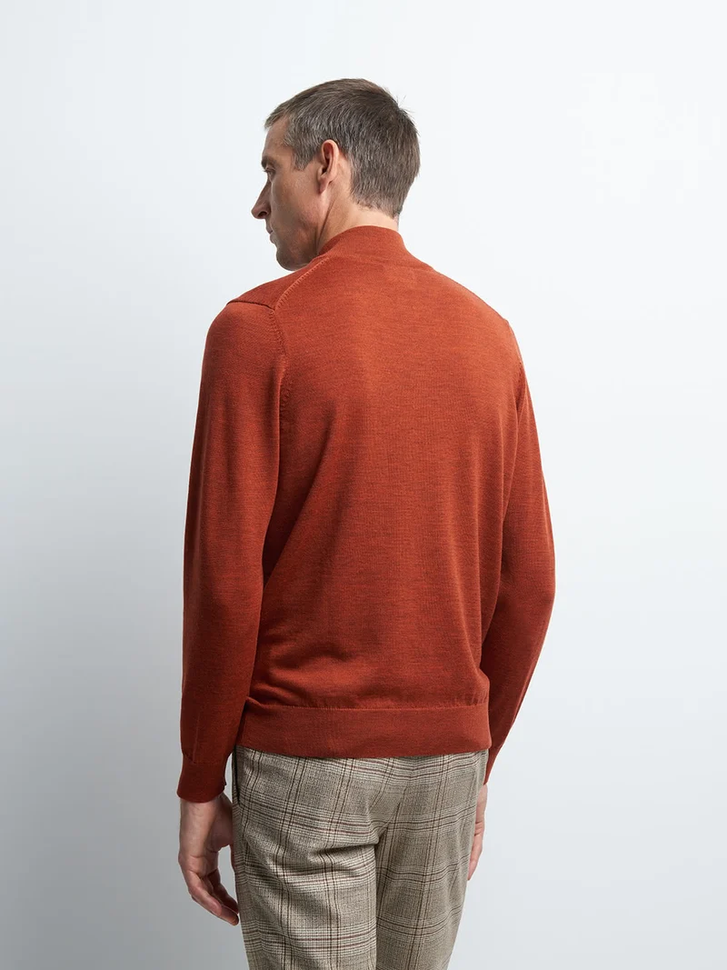 Pull col montant zippé en laine mérinos