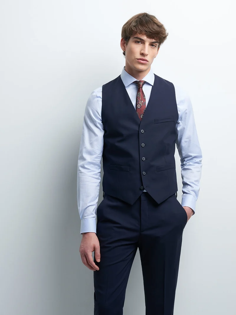 Gilet coordonnable en laine uni