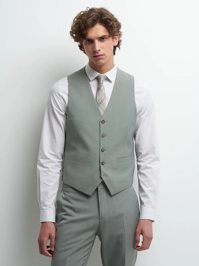 Gilet coordonnable en laine uni