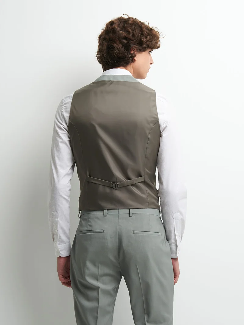 Gilet coordonnable en laine uni