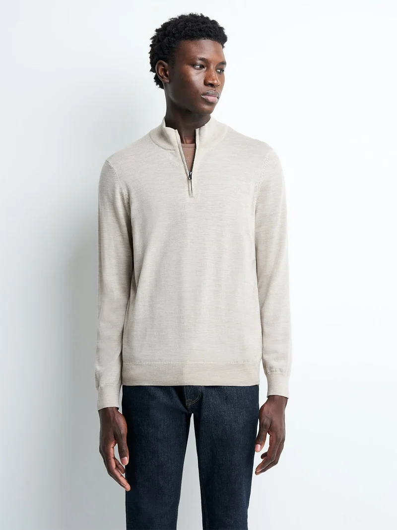 Pull col montant zippé en laine mérinos