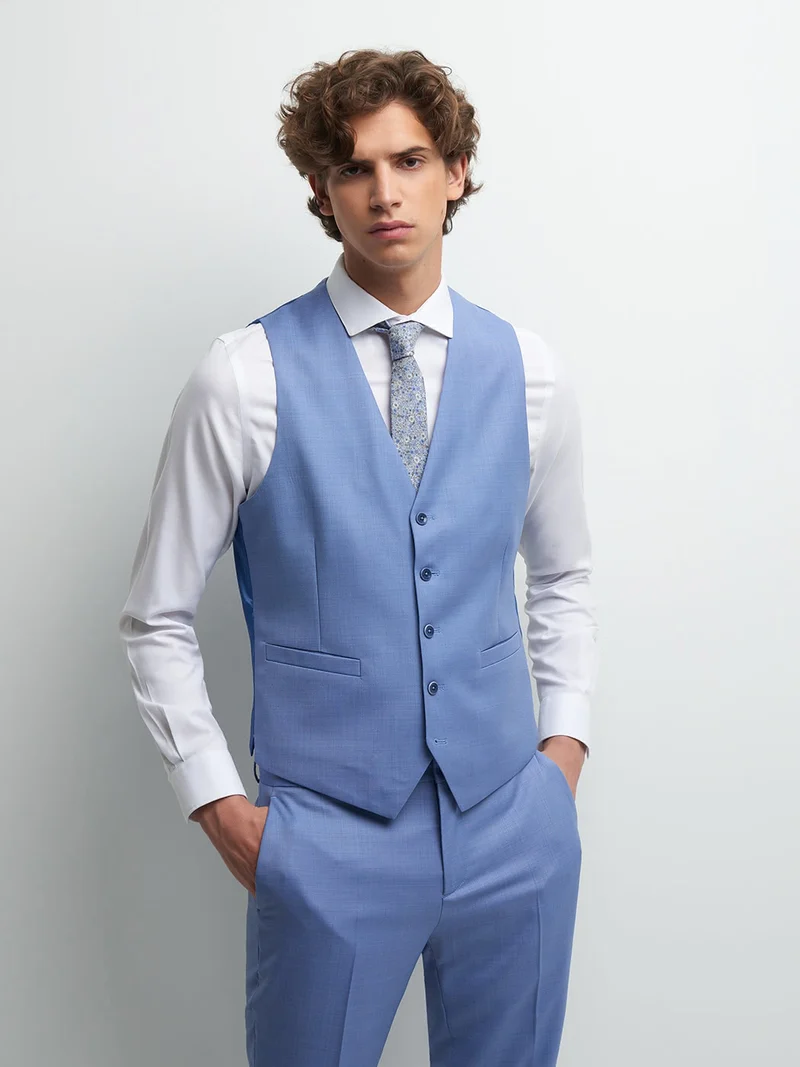 Gilet coordonnable en laine faux uni
