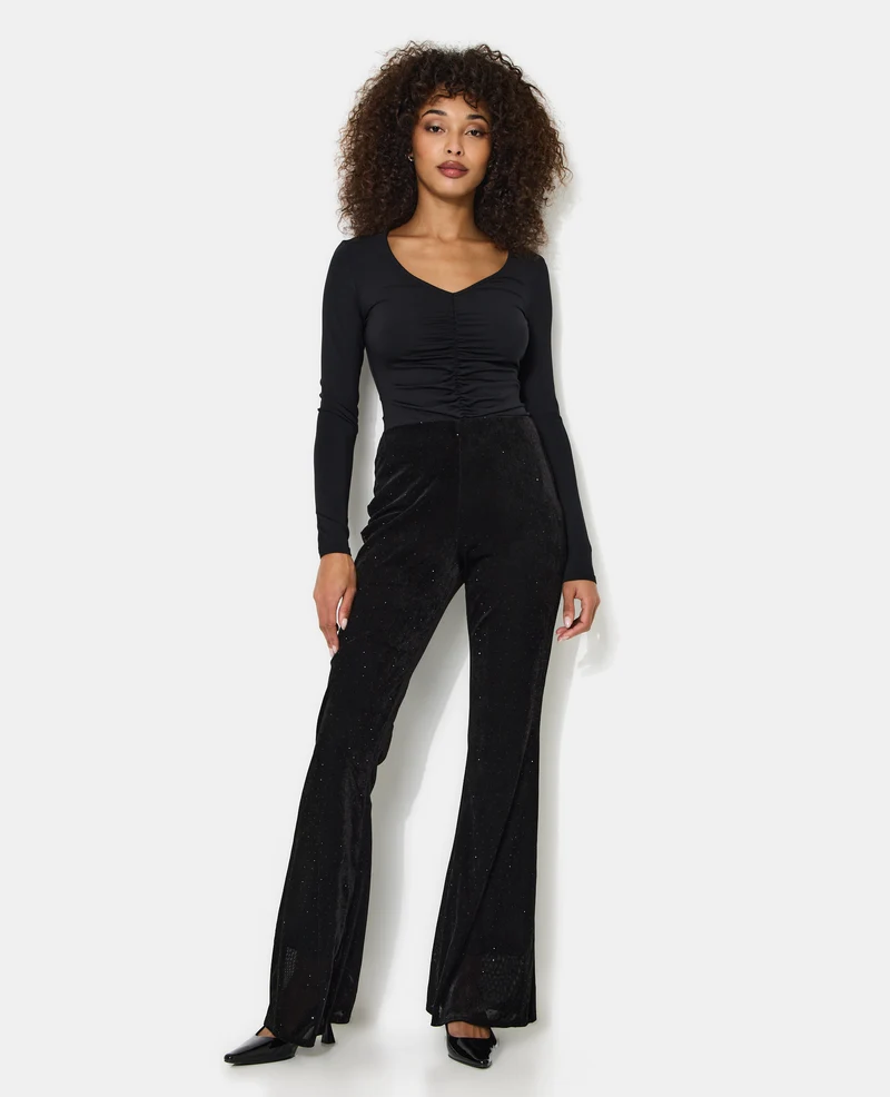 Pantalon flare en résille et velours avec strass