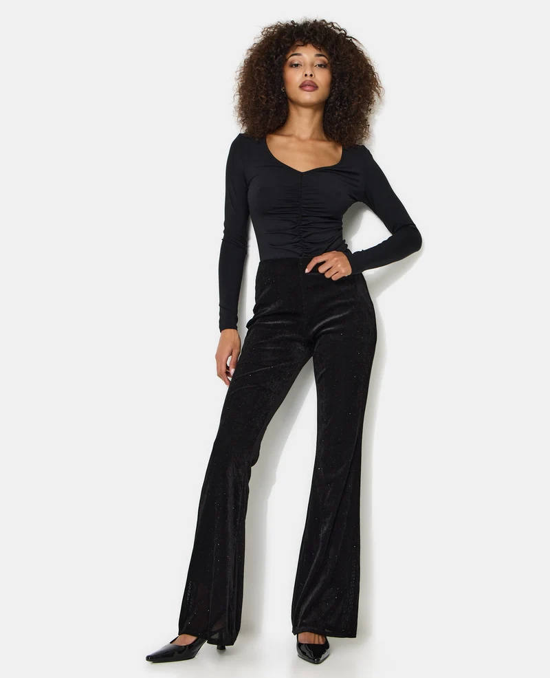 Pantalon flare en résille et velours avec strass