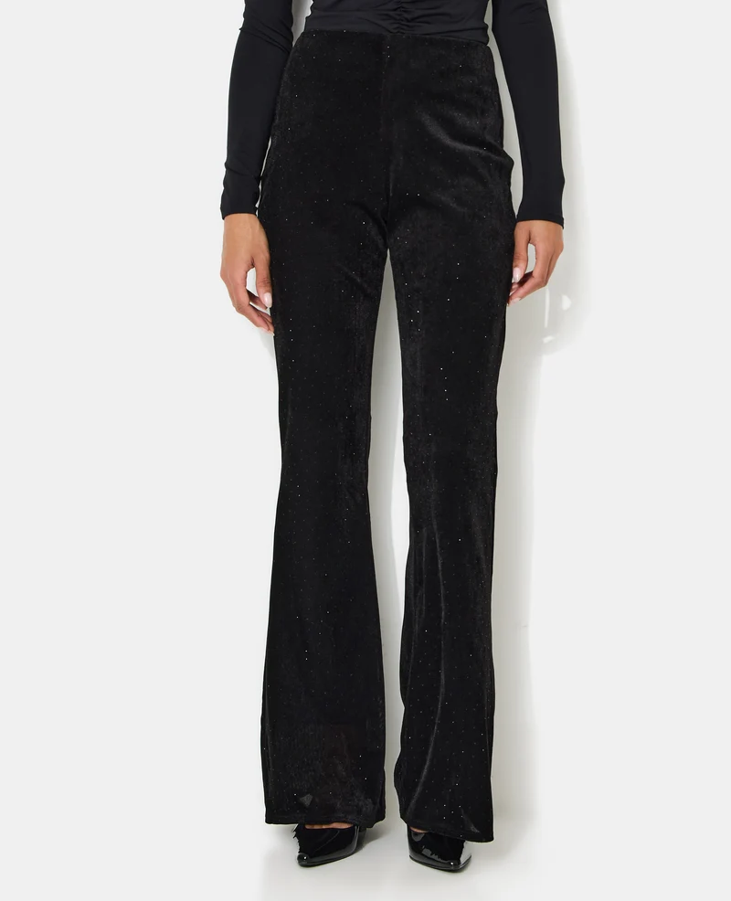 Pantalon flare en résille et velours avec strass