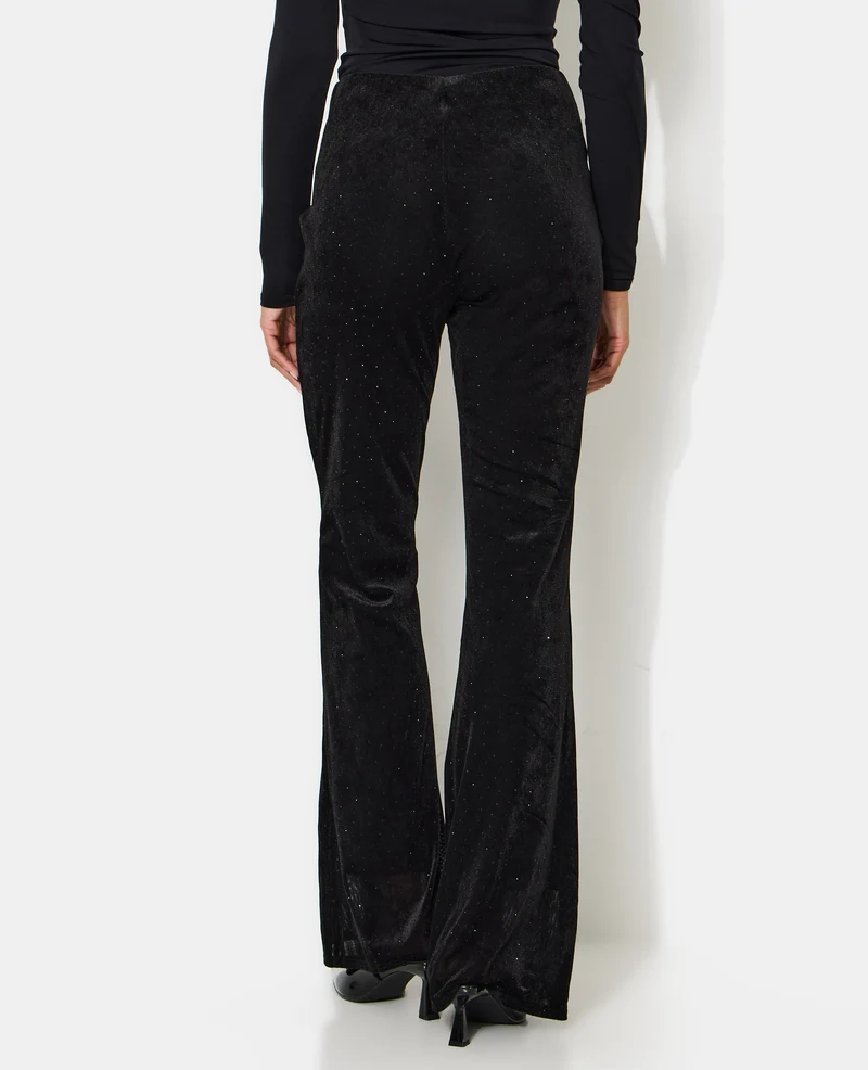 Pantalon flare en résille et velours avec strass