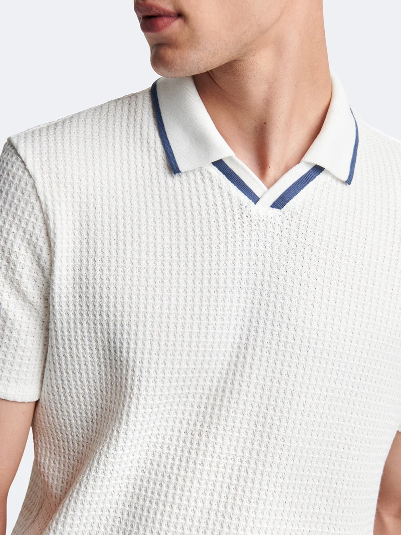 Polo manches courtes en coton col requin