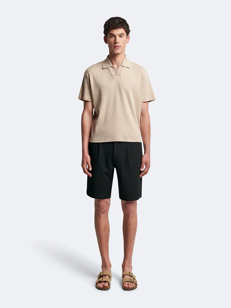 Polo manches courtes en coton col requin