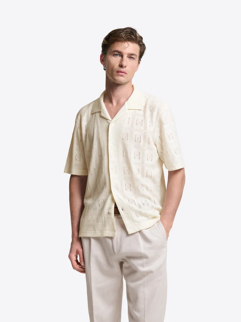 Polo col boutonné en maille crochet
