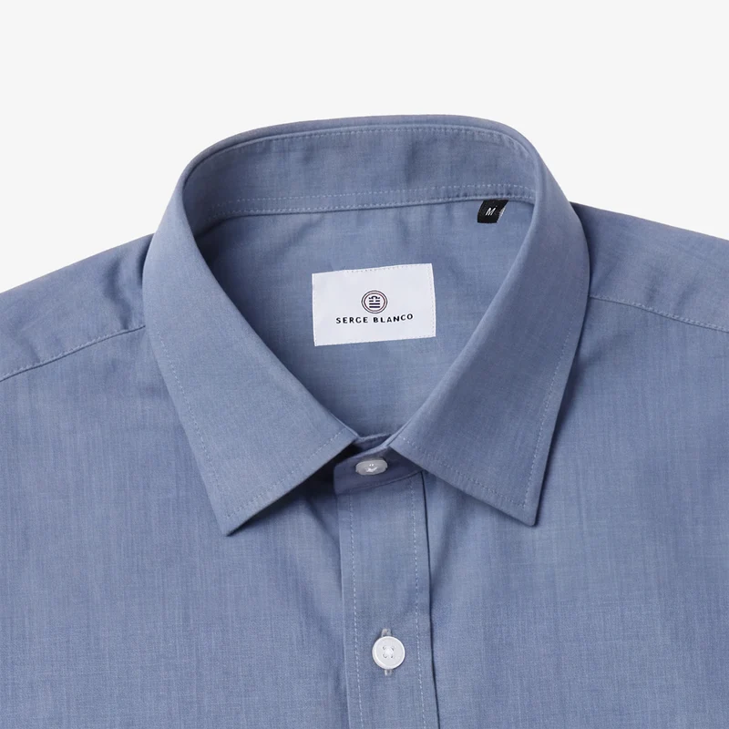Chemise manches longues en coton bleue avec poche poitrine