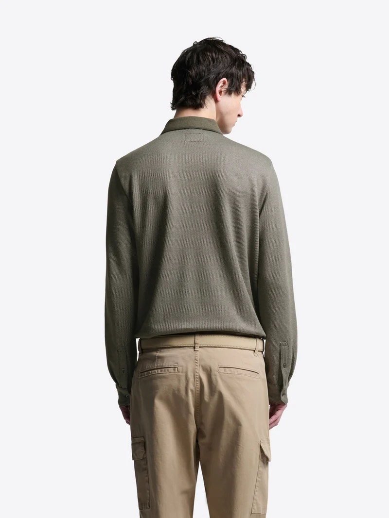 Polo manches longues en coton chiné