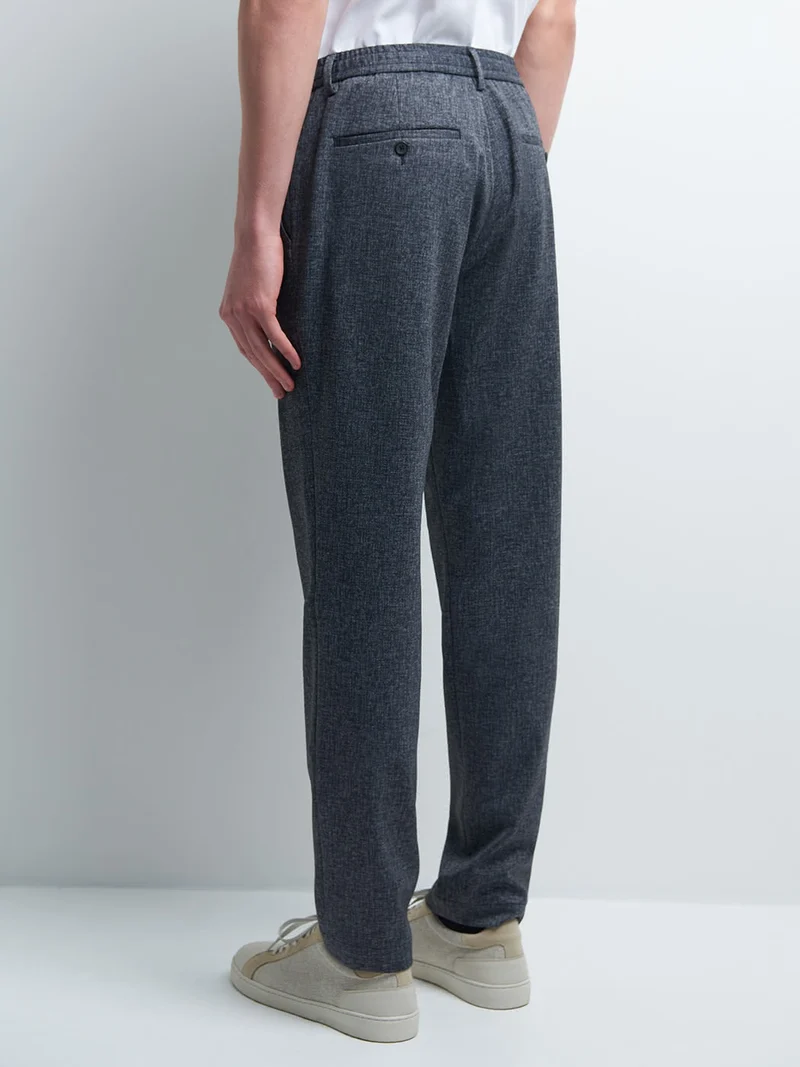 Pantalon en poly-viscose faux uni