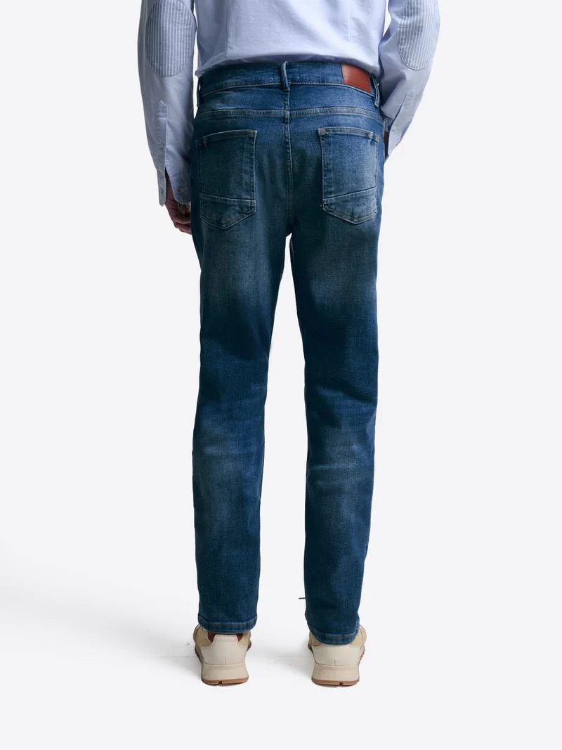 Jean denim faux-uni en coton mélangé