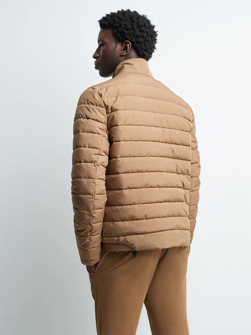 Blouson zippé matelassé col montant