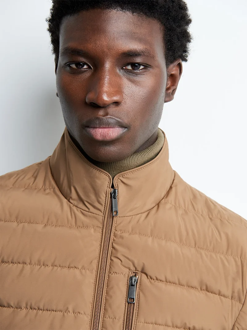 Blouson zippé matelassé col montant