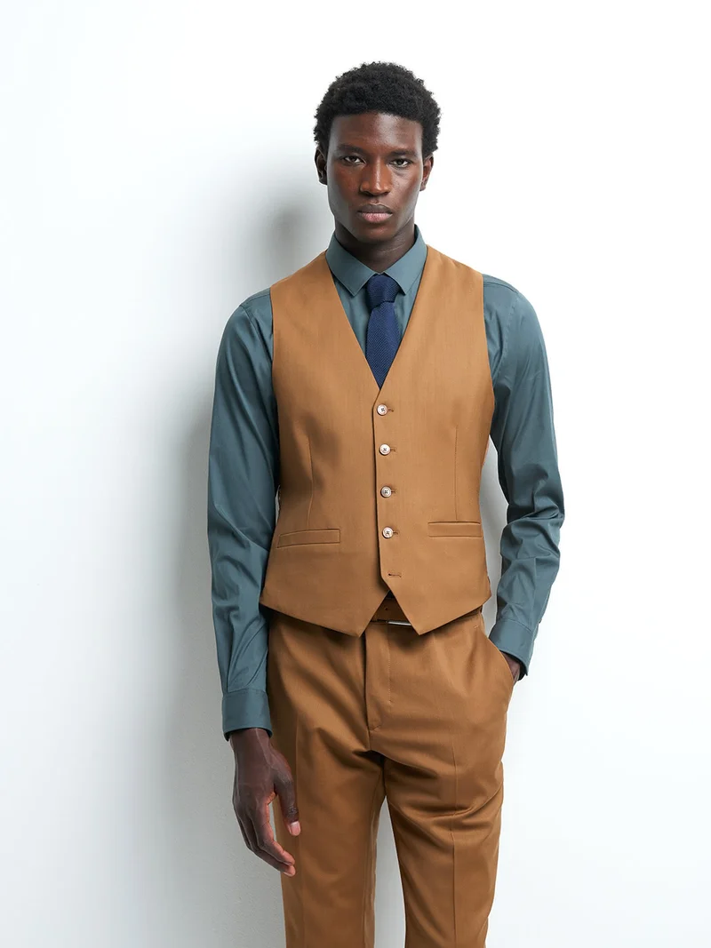 Gilet coordonnable en laine uni
