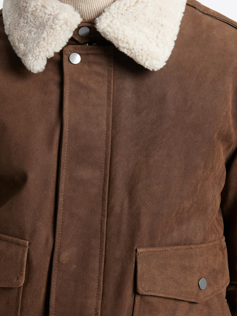 Blouson col sherpa en cuir