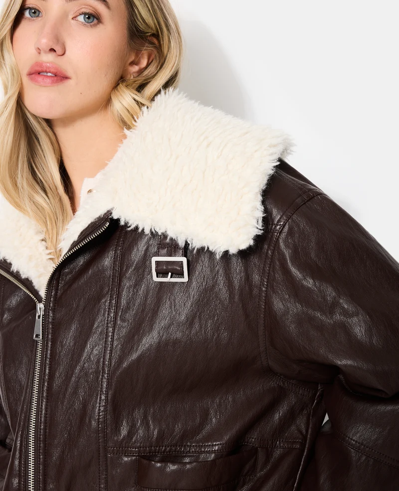 Blouson en simili grand col fausse fourrure