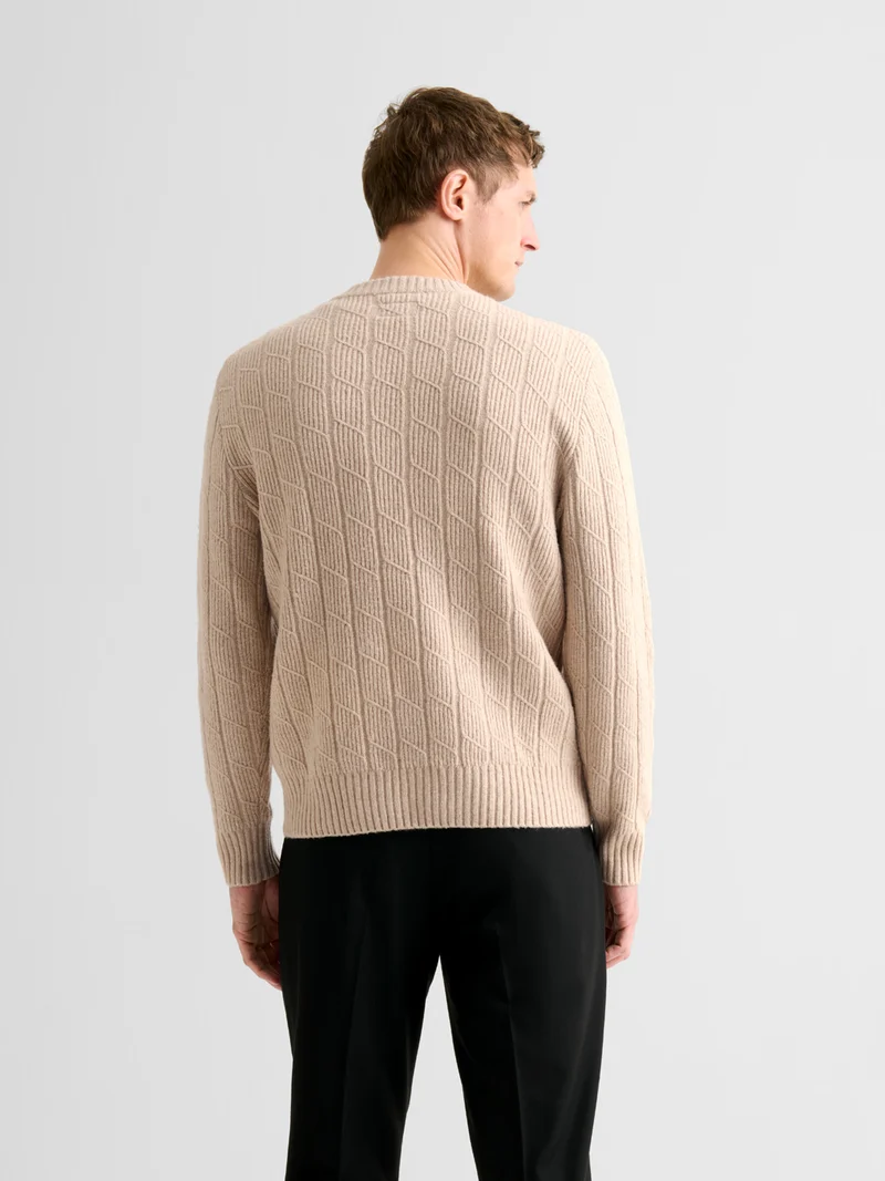 Pull col rond maille torsadée