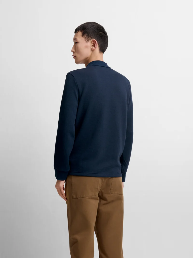Polo manches longues col boutonné