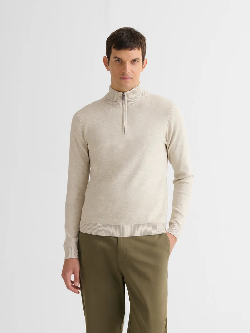 Pull col cheminée zippé
