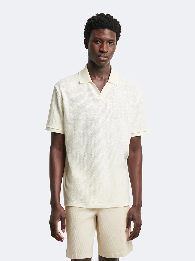 Polo manches courtes en coton à motif