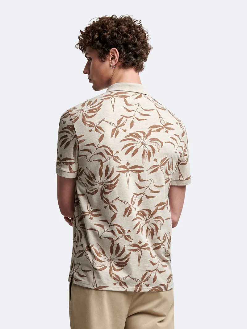 Polo manches courtes en coton fleuri