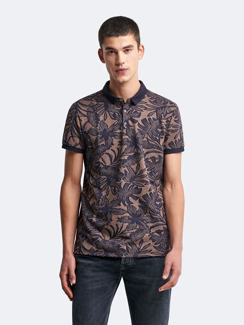 Polo manches courtes en coton fleuri