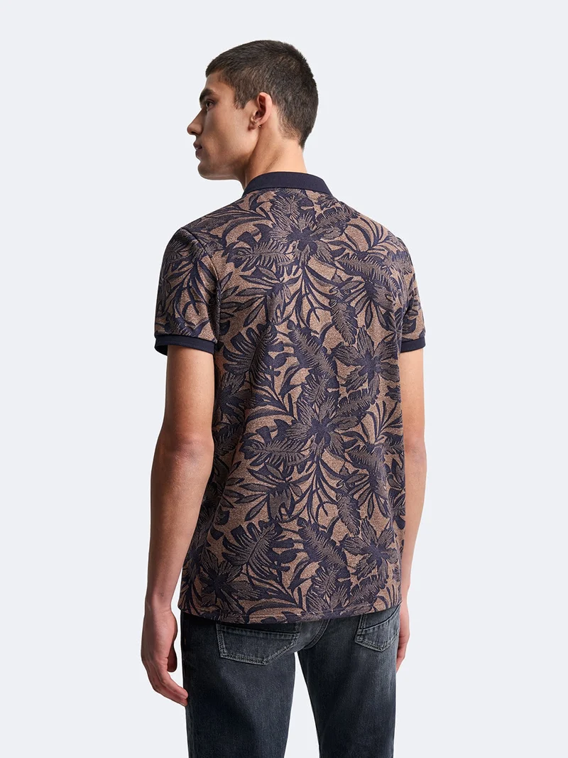 Polo manches courtes en coton fleuri