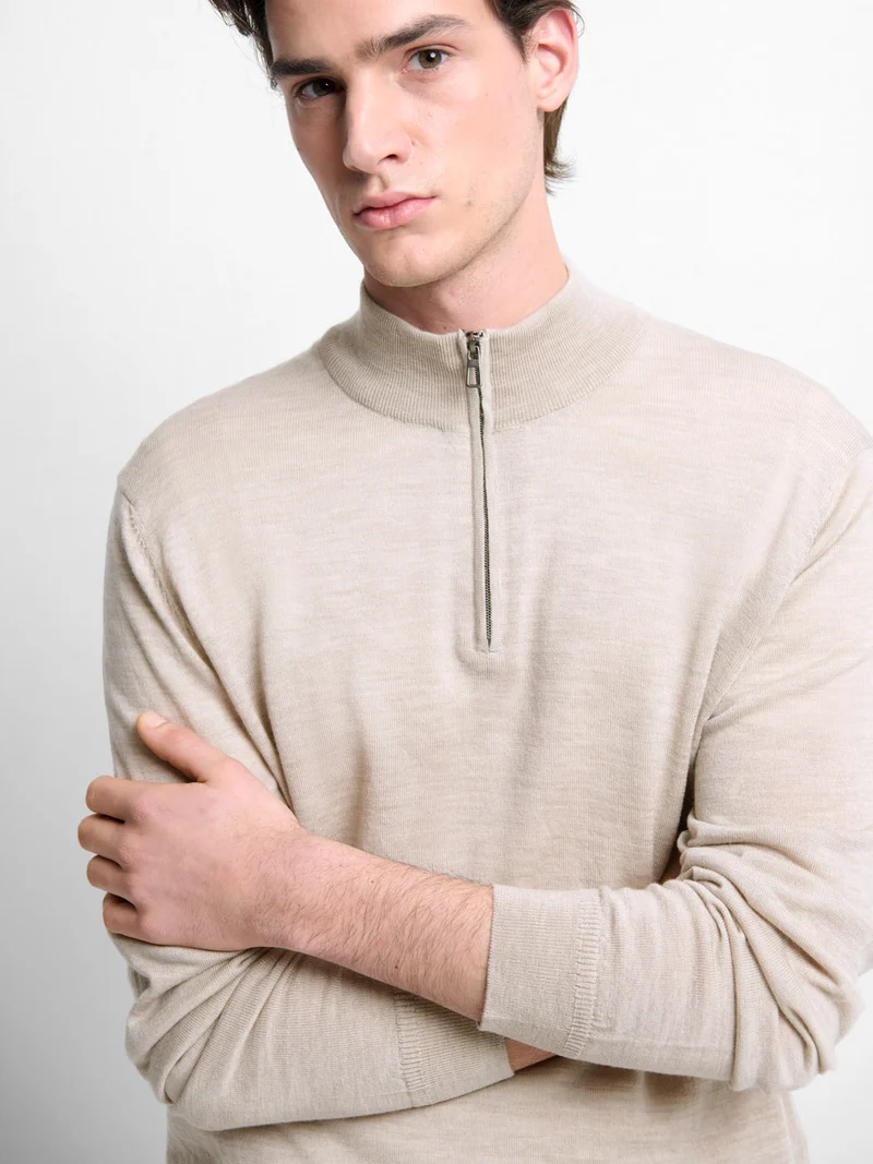 Pull col cheminée zippé en laine Mérinos