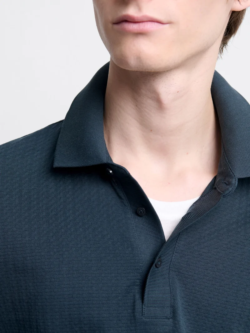Polo manches longues col boutonné