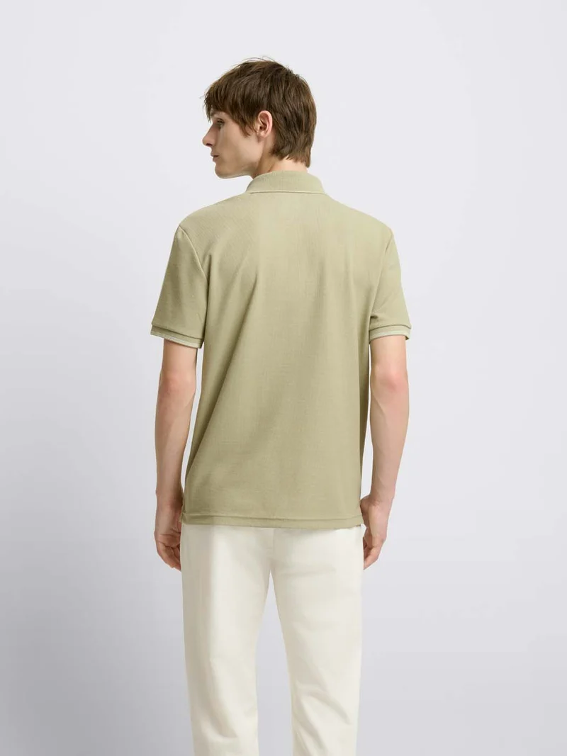 Polo col boutonné gauffré