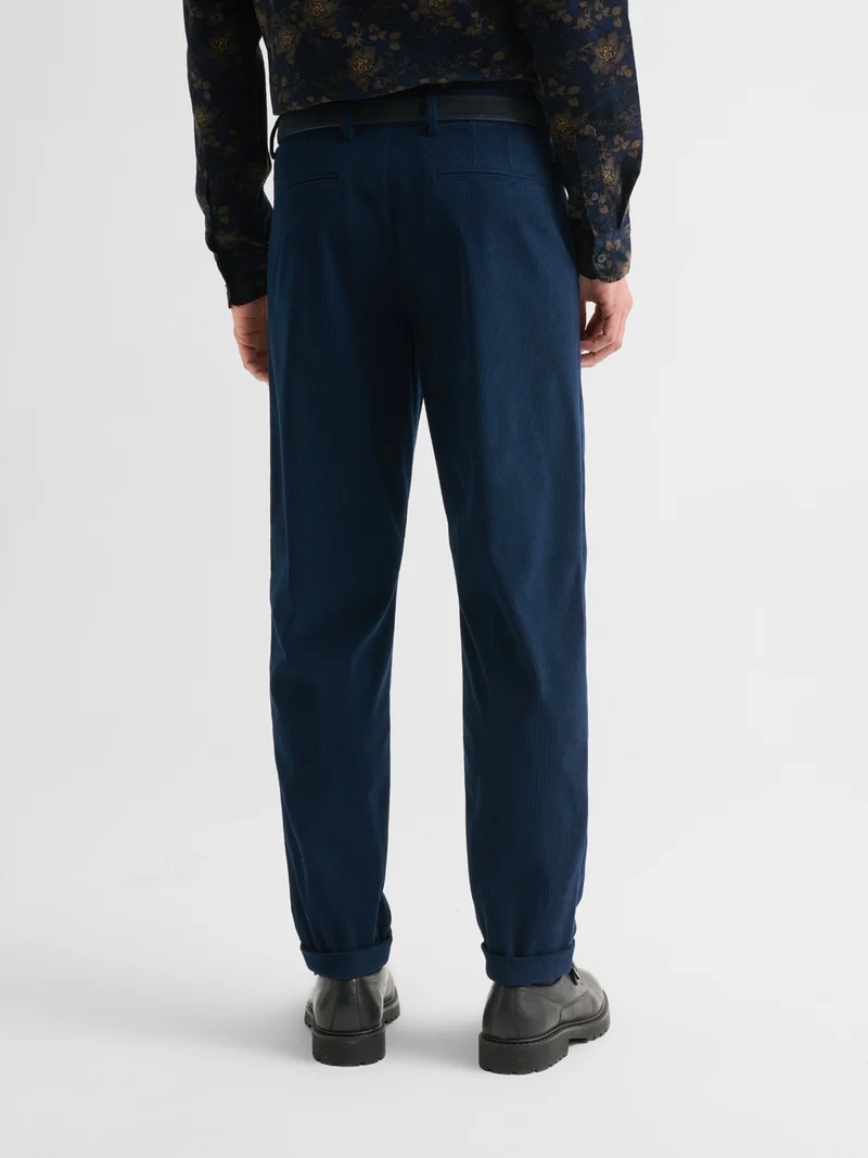 Pantalon à pinces en velours côtelé