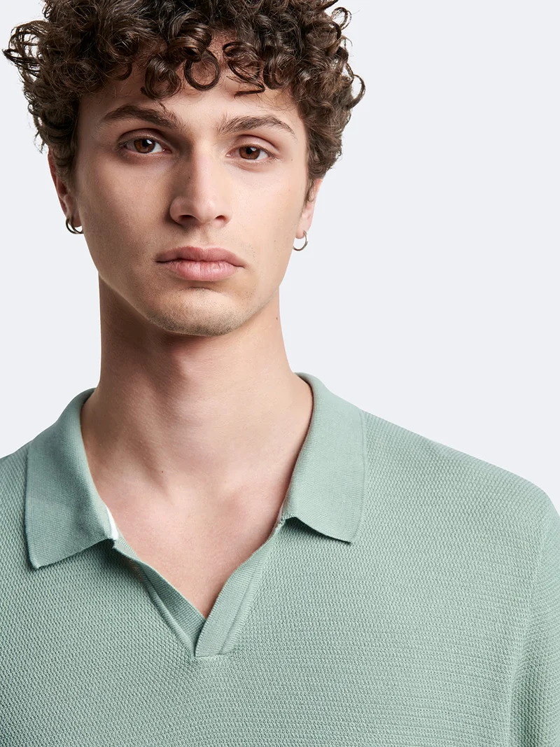 Polo maille col ouvert en coton bio