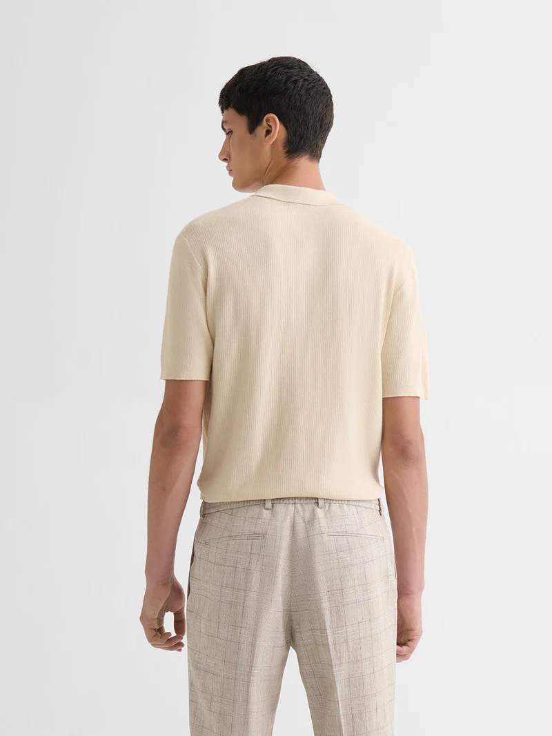 Polo col boutonné jeux de points