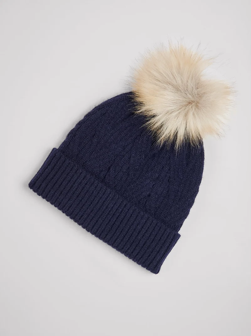 Bonnet uni à pompon