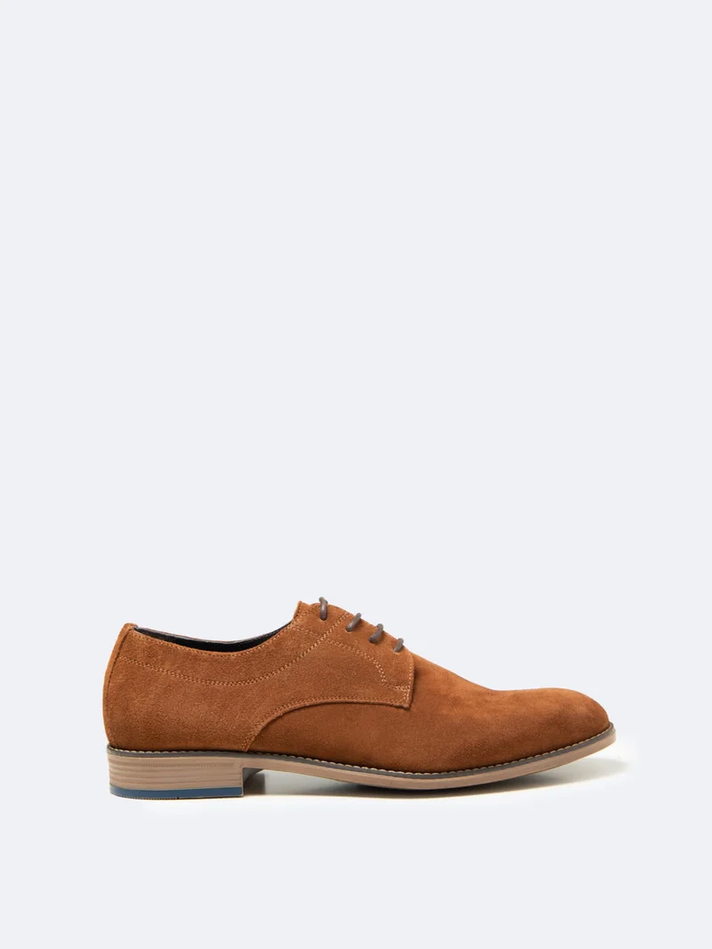 Derbies en cuir suédé