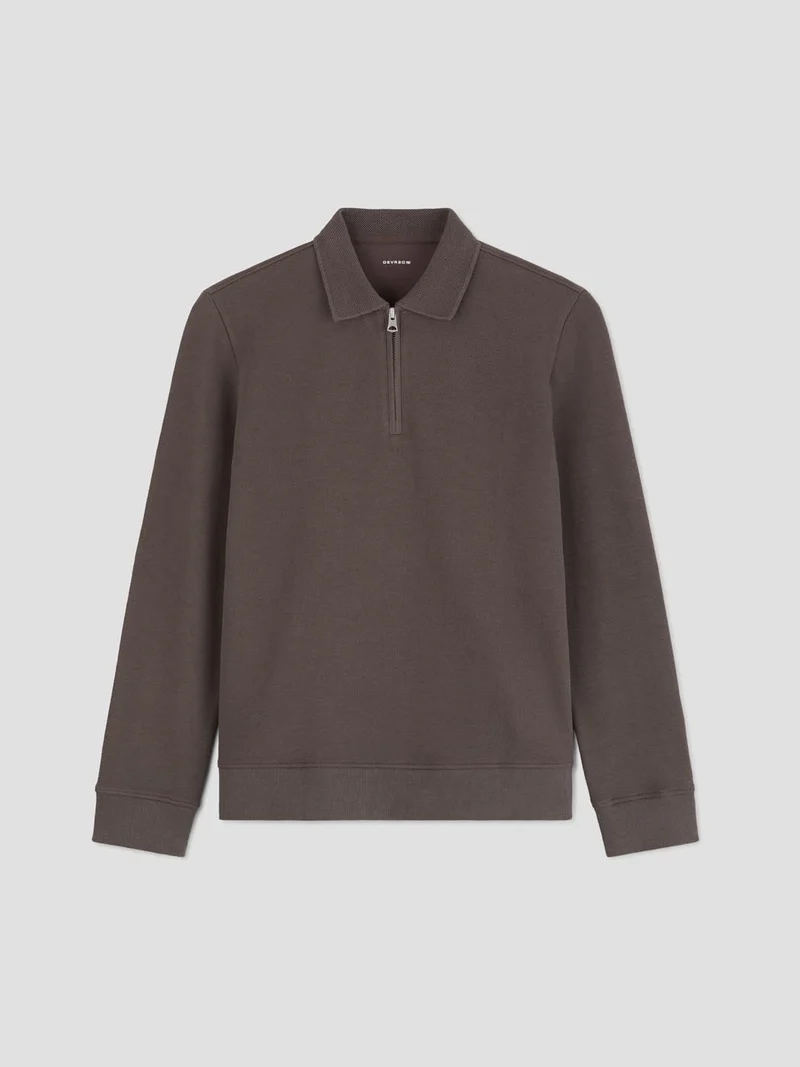 Polo manches longues col zippé
