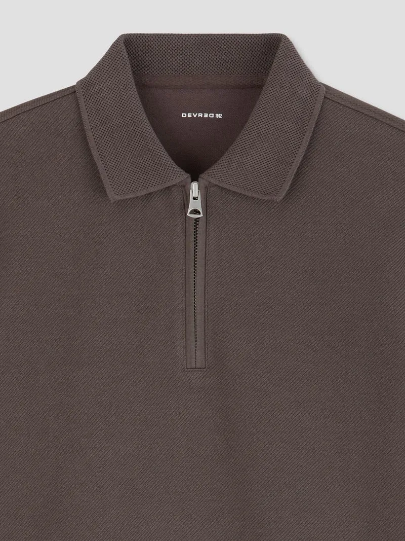 Polo manches longues col zippé