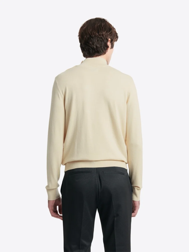 Pull col cheminée épaule boutonnée