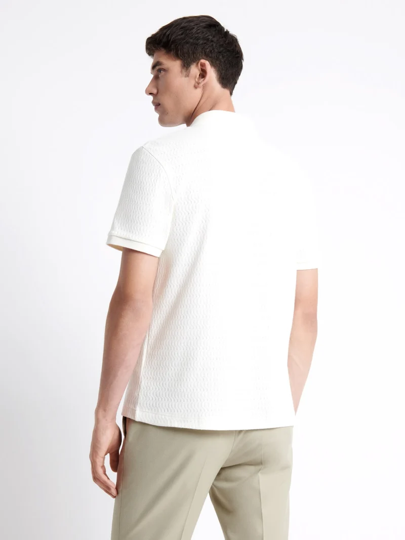 Polo manches courtes à relief 100% coton