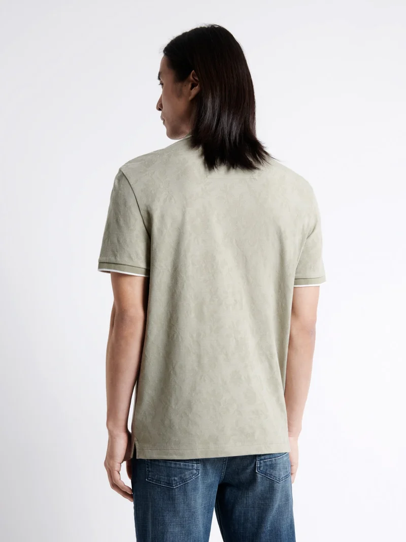 Polo manches courtes fleuri en coton