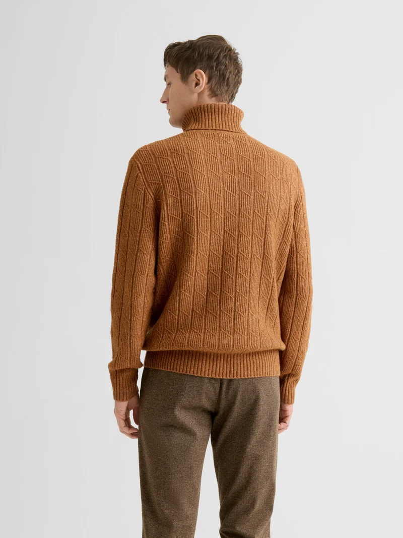 Pull col roulé chiné