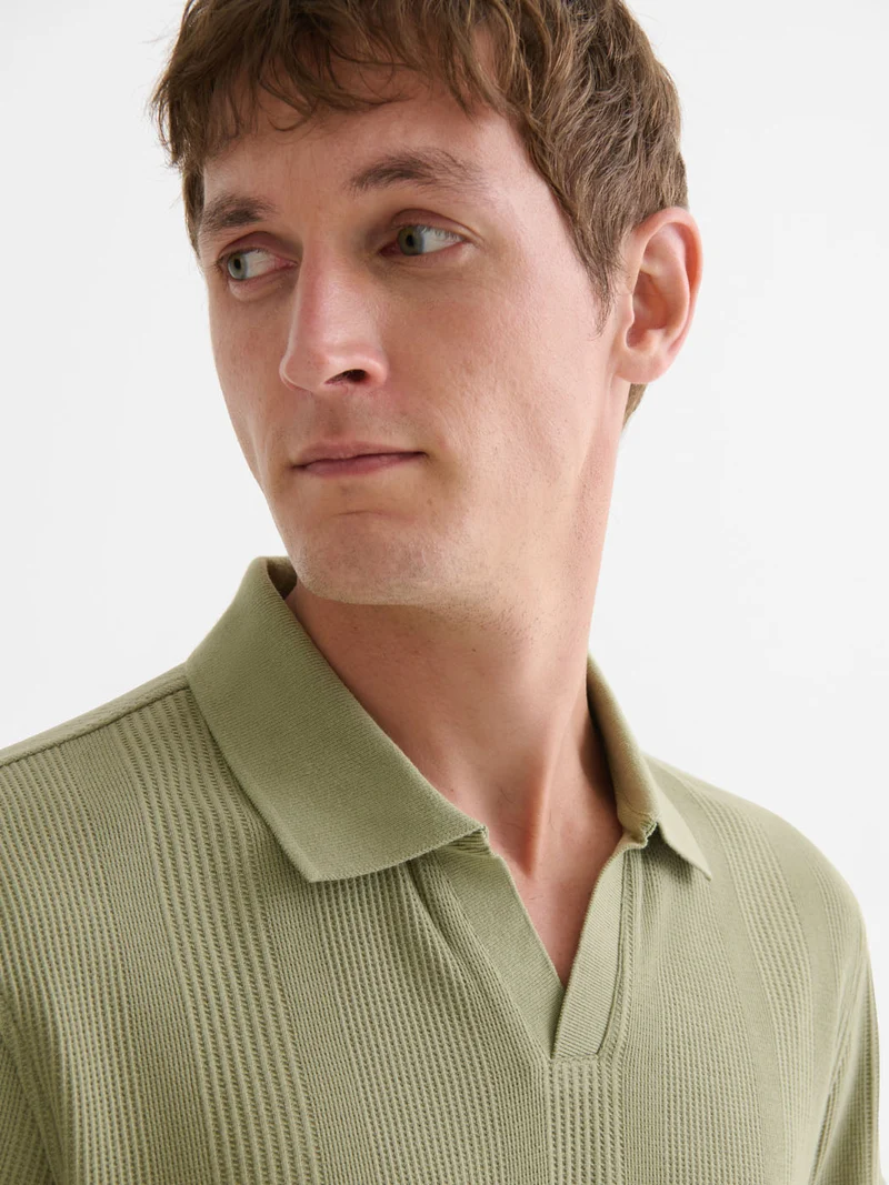 Polo col ouvert gauffré