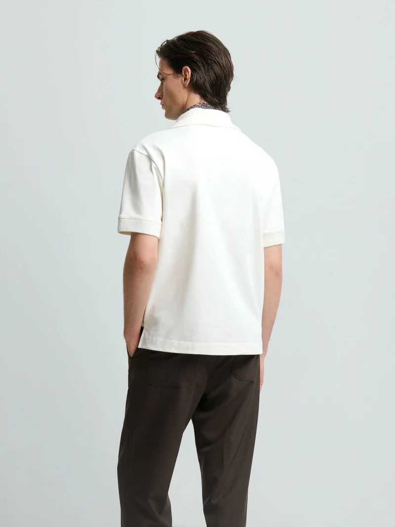 Polo col V - L'Atelier