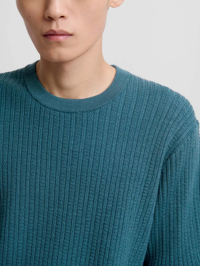 Pull col rond en maille torsadée