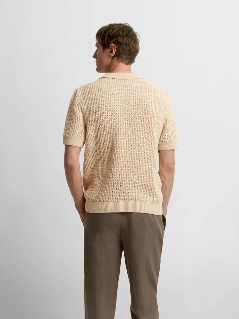 Polo maille col V ajouré